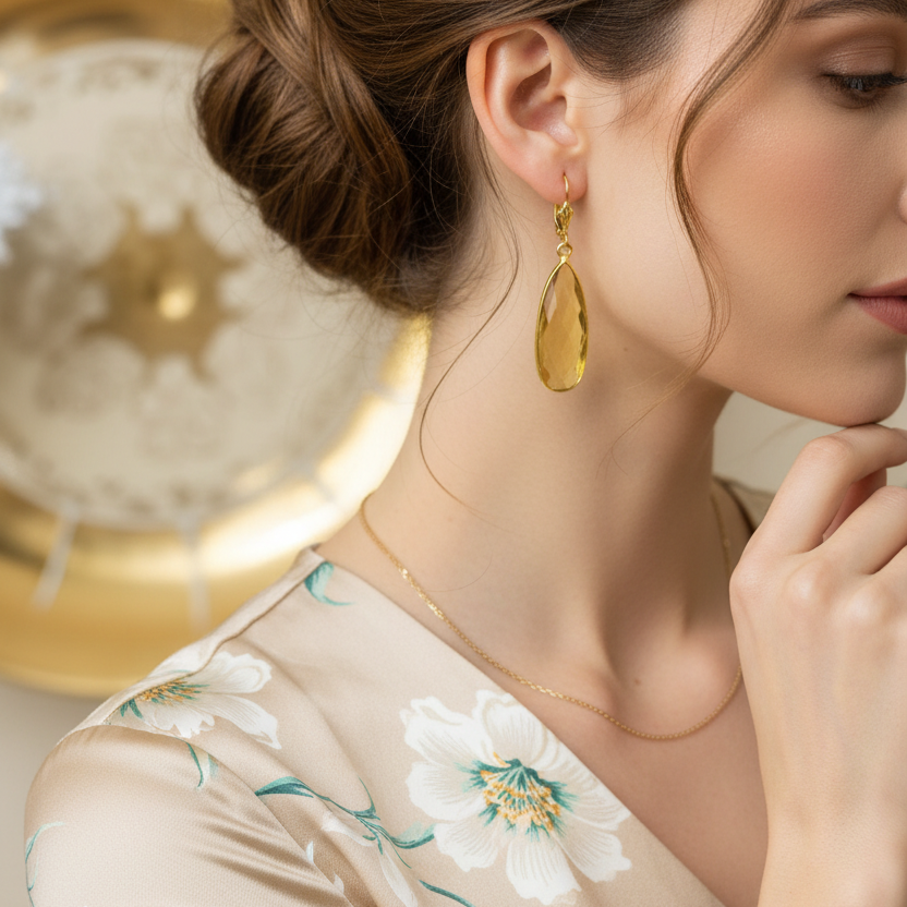 Closeup of elegant woman wearing citrine teardrop gold earrings — Teramasu designer handmade jewelry, Pinehurst NC
