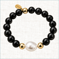Teramasu Luxury Gratitude bracelet featuring black onyx beads, a baroque pearl, and gold-filled beads.