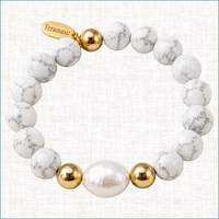 Teramasu Howlite gemstone bracelet with a baroque pearl and gold-filled beads on a light linen background.