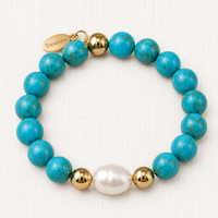 Luxury handmade turquoise and baroque pearl bracelet with gold-filled accents by Teramasu on a light linen background.