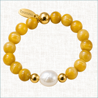 Teramasu Yellow Agate bracelet with baroque pearl, gold-filled beads, and signature gold tag.